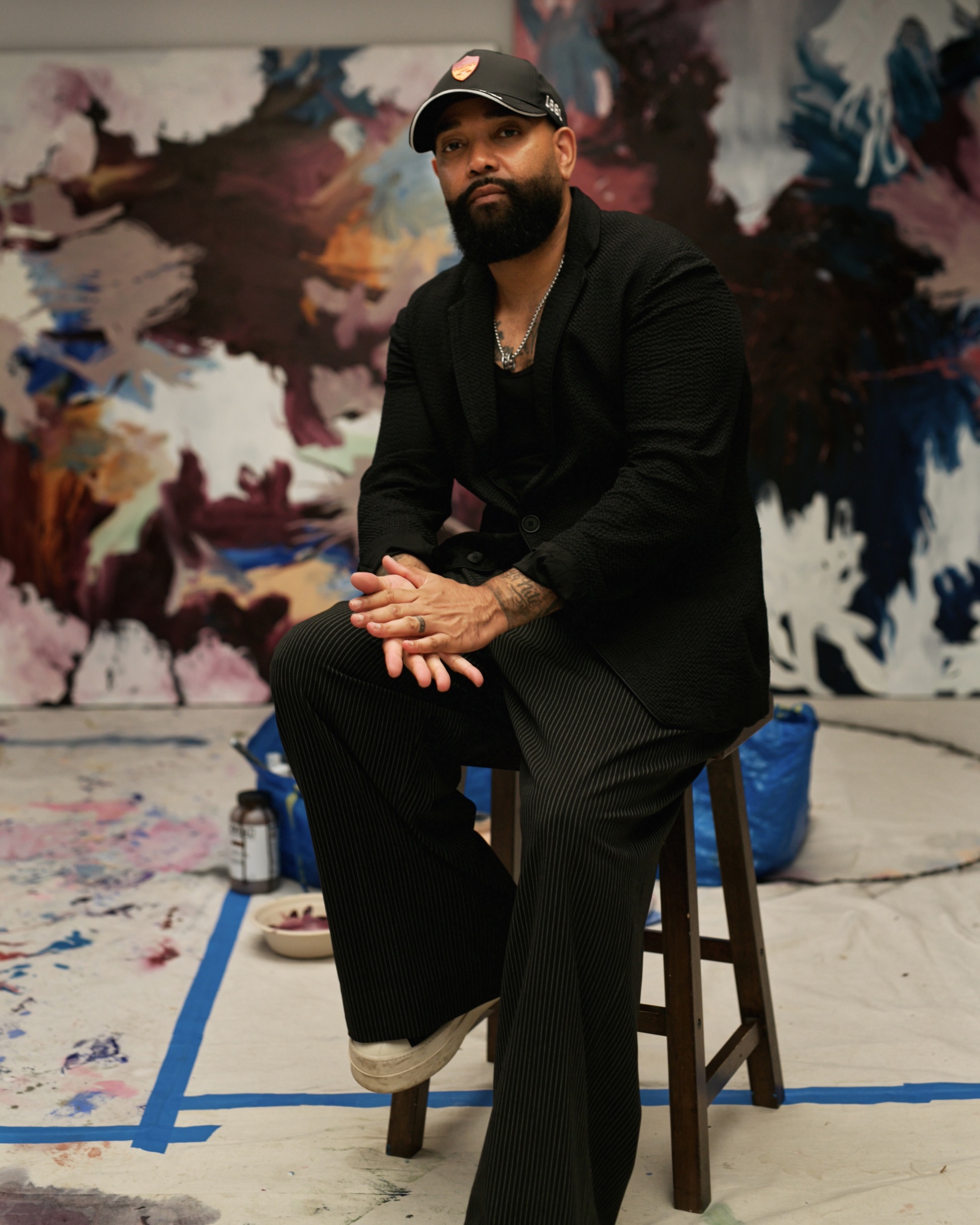 Portrait of artist Fontaine Scarelli seated in his Chicago studio